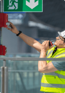 Engineer testing a fire alarm pull station