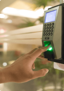 Hand using a biometric fingerprint scanner